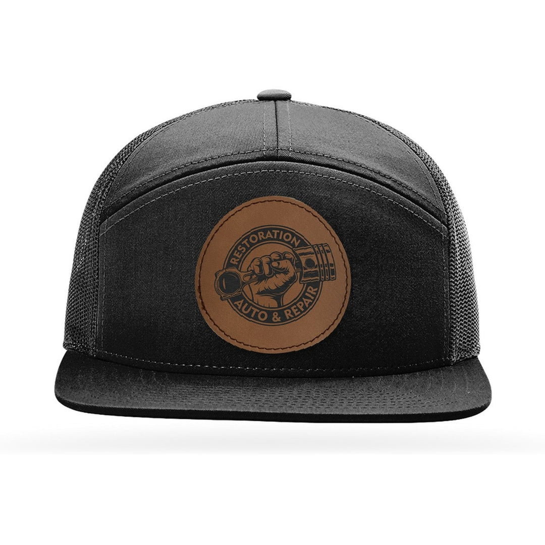 Richardson 168 7-Panel Trucker in Black with a custom leatherette logo patch