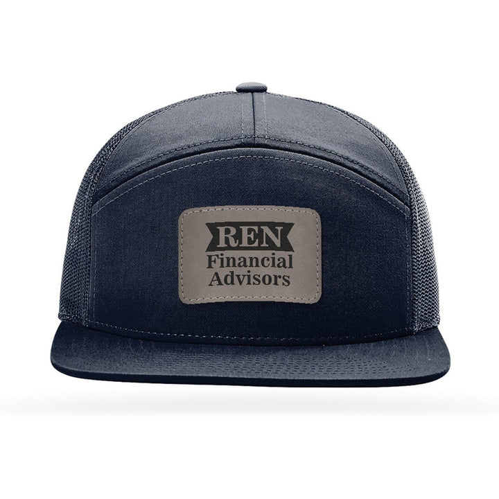 Richardson 168 7-Panel Trucker in Navy with a custom leatherette logo patch