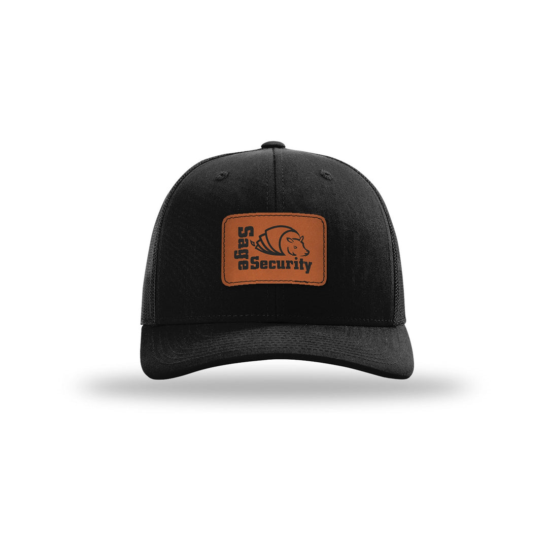 Richardson 112 Trucker in Black with a custom leatherette logo patch