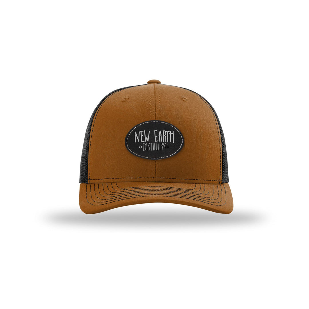 Richardson 112 Trucker in Caramel/Black with a custom leatherette logo patch