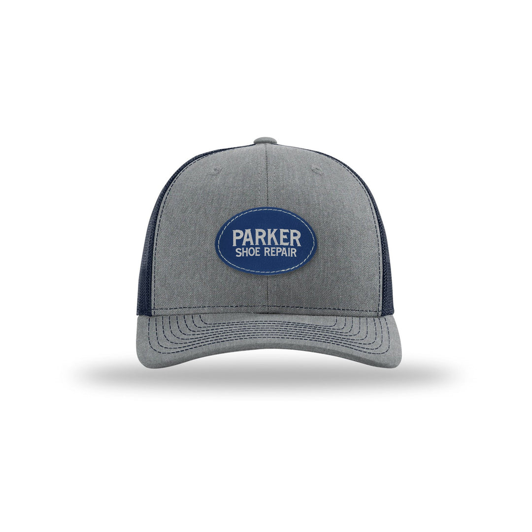 Richardson 112 Trucker in Heather Grey/Navy with a custom leatherette logo patch