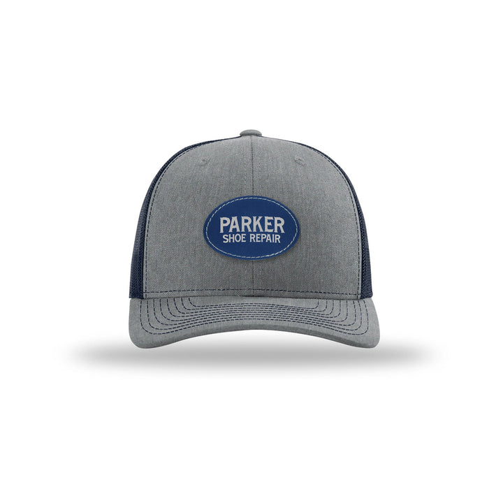 Richardson 112 Trucker in Heather Grey/Navy with a custom leatherette logo patch