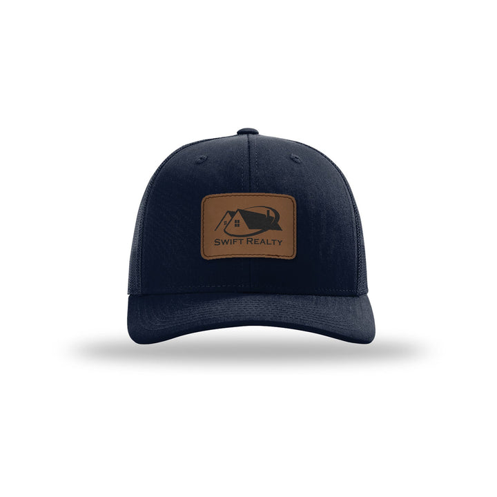 Richardson 112 Trucker in Navy with a custom leatherette logo patch