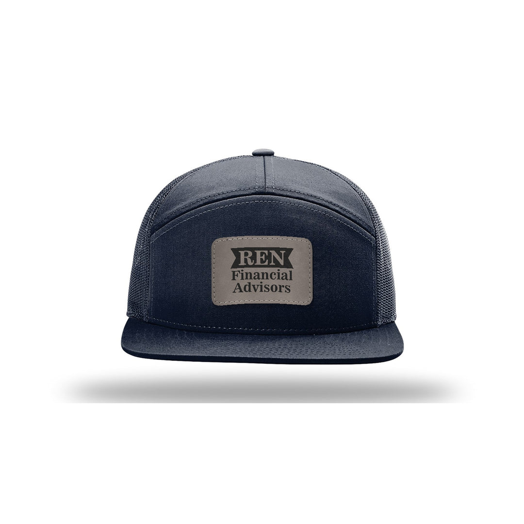 Richardson 168 7-Panel Trucker in Navy with a custom leatherette logo patch