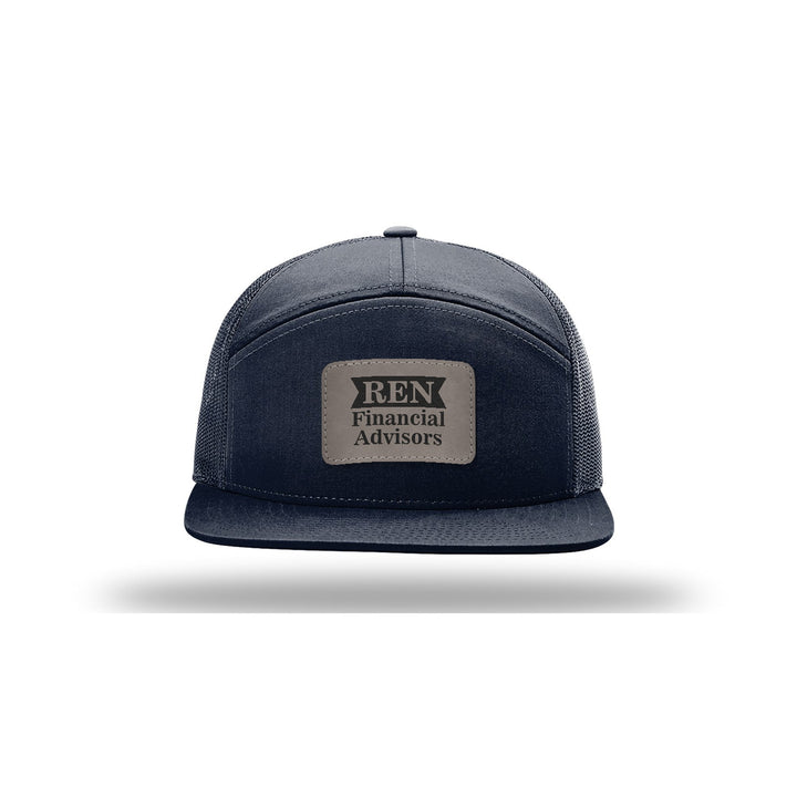 Richardson 168 7-Panel Trucker in Navy with a custom leatherette logo patch