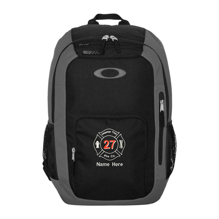 Oakley 22L Enduro Backpack in Grigio Scuro embroidered with a fire department Maltese cross and name