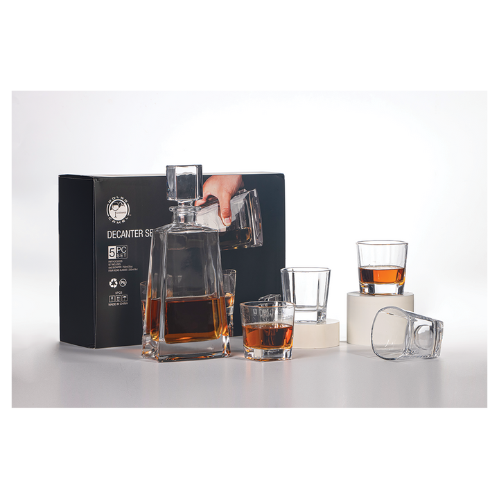 Black decanter set with square bottle, pourer top, and four drinking glasses filled with amber liquid, displayed with branded black box packaging.