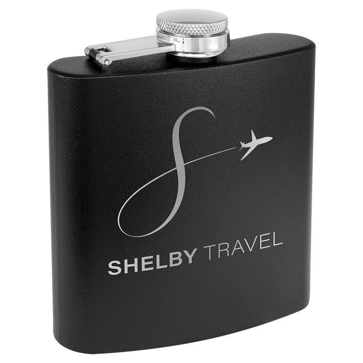 Black powder coated flask with Shelby Travel logo and airplane design engraved in silver.