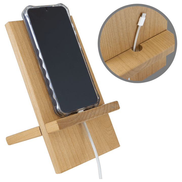 Phone charging on the stand with the cord passing through the slot