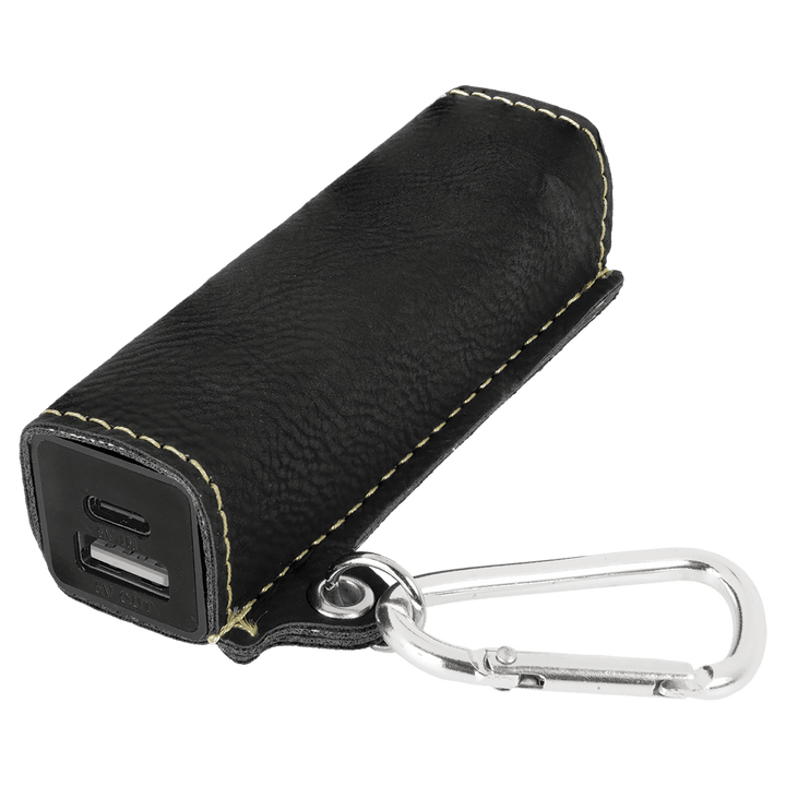 Black/gold leatherette power bank with USB-C and USB ports and carabiner clip