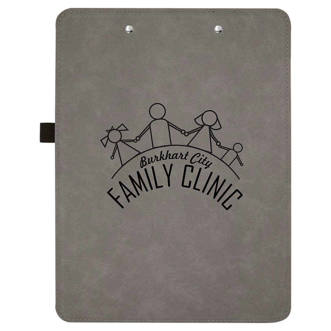 Gray leatherette clipboard with "Burkhart Family Clinic" logo and stick figure family design engraved on front.