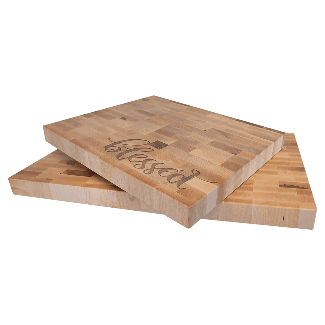 Two maple butcher block boards, one engraved with blessed in script, showing the thickness