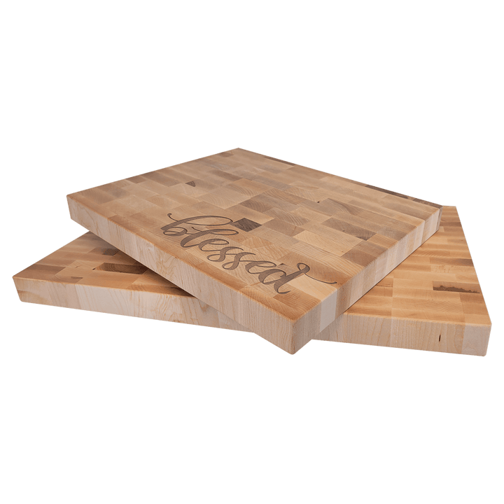 Two maple butcher block boards, one engraved with blessed in script, showing the thickness