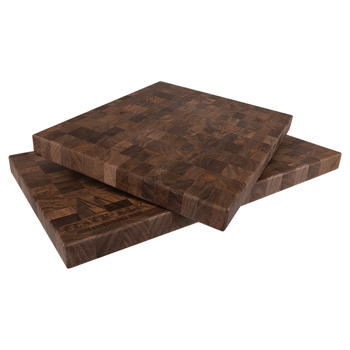 Walnut butcher block boards with an engraved logo on the edge