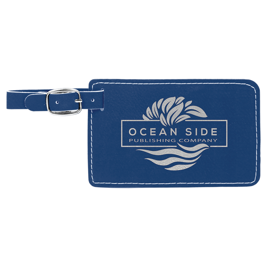 Navy leather luggage tag with Ocean Side Publishing Company logo and silver buckle strap