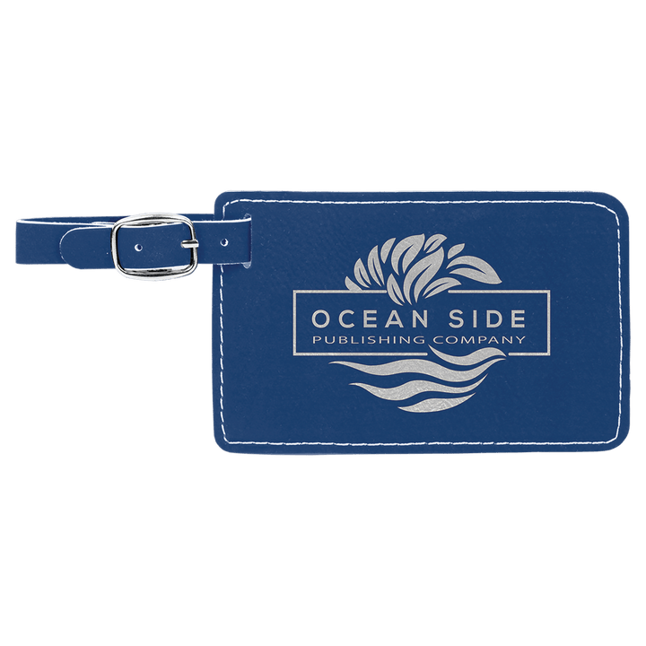 Navy leather luggage tag with Ocean Side Publishing Company logo and silver buckle strap