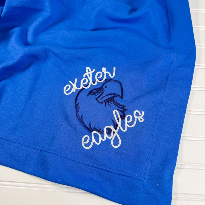Royal blue fleece blanket with embroidered Exeter Eagles mascot and script text design