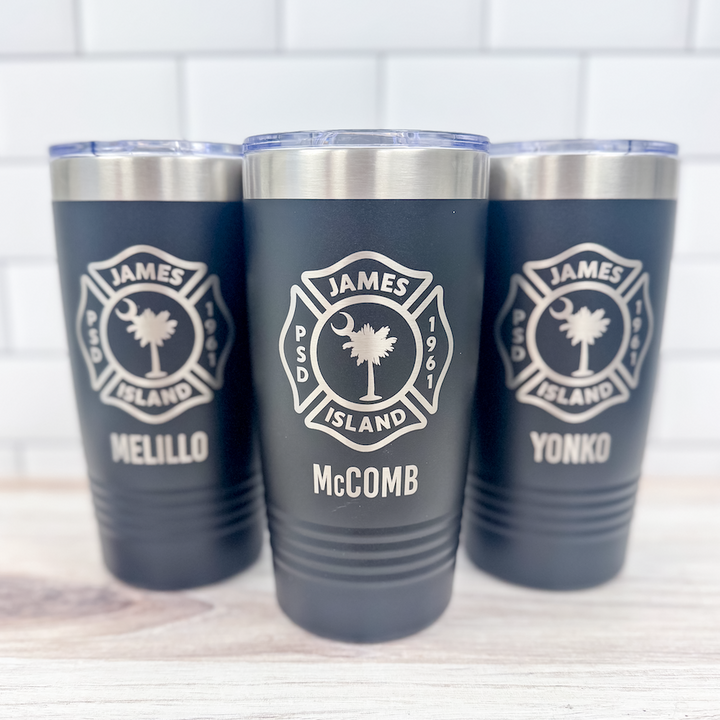 Three navy blue insulated tumblers with stainless steel bands, each laser engraved with a James Island fire department palmetto tree badge and personalized names including McComb.