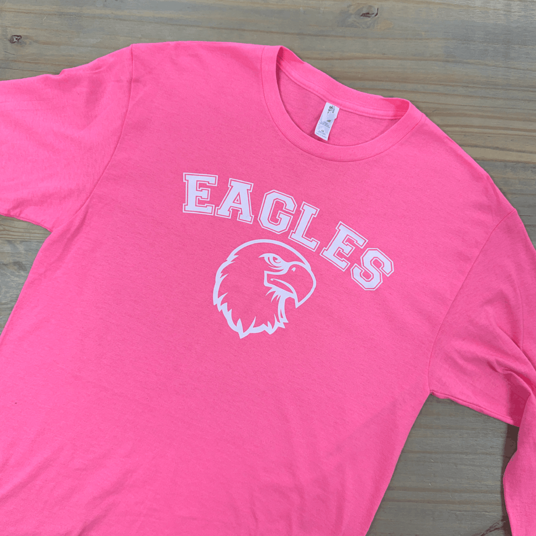 Bright pink long sleeve t-shirt with white "EAGLES" text and eagle logo graphic on chest