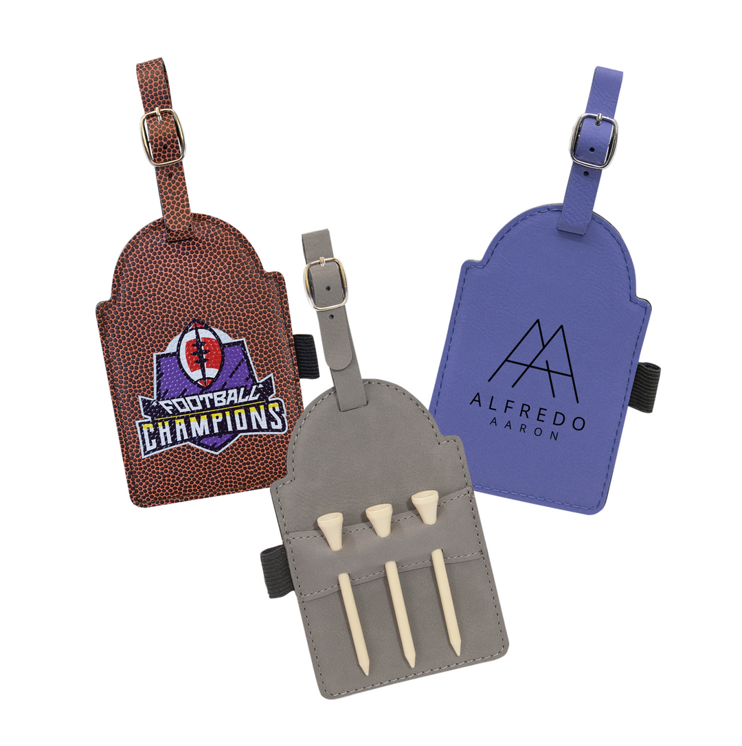Three leather golf tags in brown, blue, and gray with custom logos and adjustable straps.