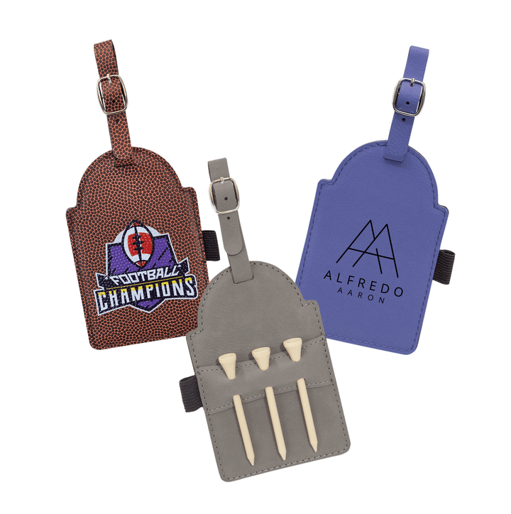 Three leather golf tags in brown, blue, and gray with custom logos and adjustable straps.