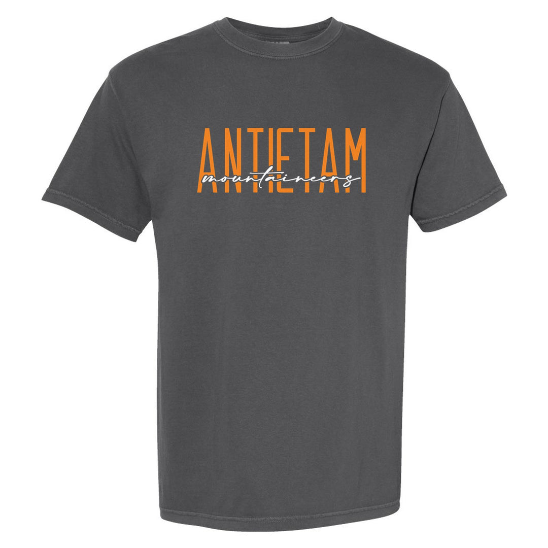Antietam Mountaineers Tall Type Script comfort colors t-shirt in Pepper: tall ANTIETAM lettering with Mountaineers in flowing script across the middle