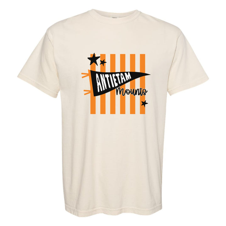 Antietam Mountaineers Pennant Stripes comfort colors t-shirt in Ivory: an Antietam pennant and Mounts script over orange stripes and stars