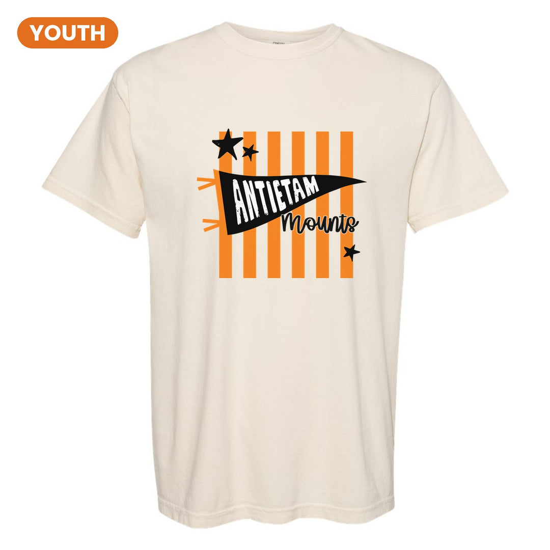 Antietam Mountaineers Pennant Stripes youth comfort colors t-shirt in Ivory: an Antietam pennant and Mounts script over orange stripes and stars