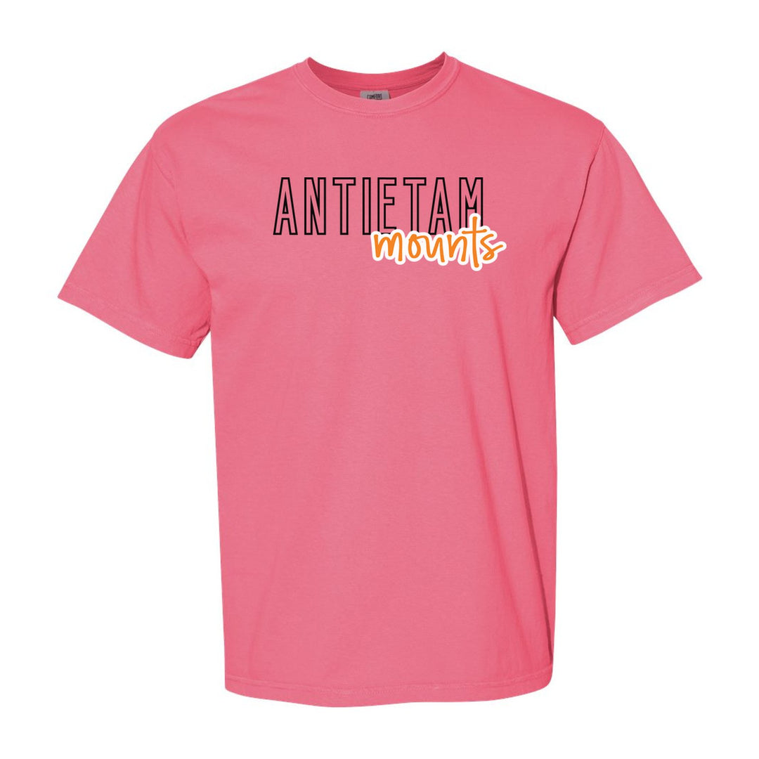 Antietam Mountaineers Outline Script comfort colors t-shirt in Crunchberry: outlined ANTIETAM letters with mounts script across the front