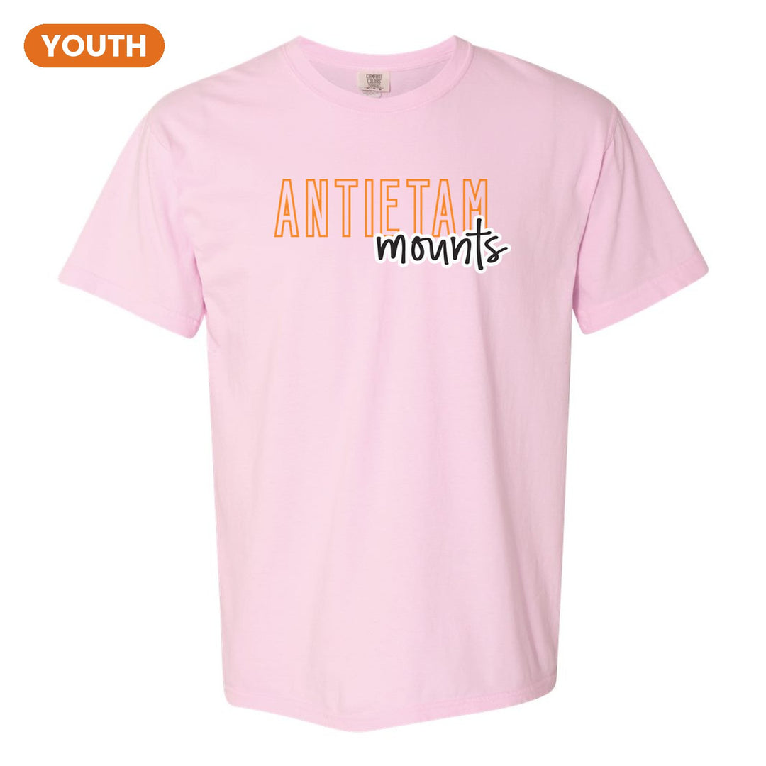 Antietam Mountaineers Outline Script youth comfort colors t-shirt in Blossom: outlined ANTIETAM letters with mounts script across the front