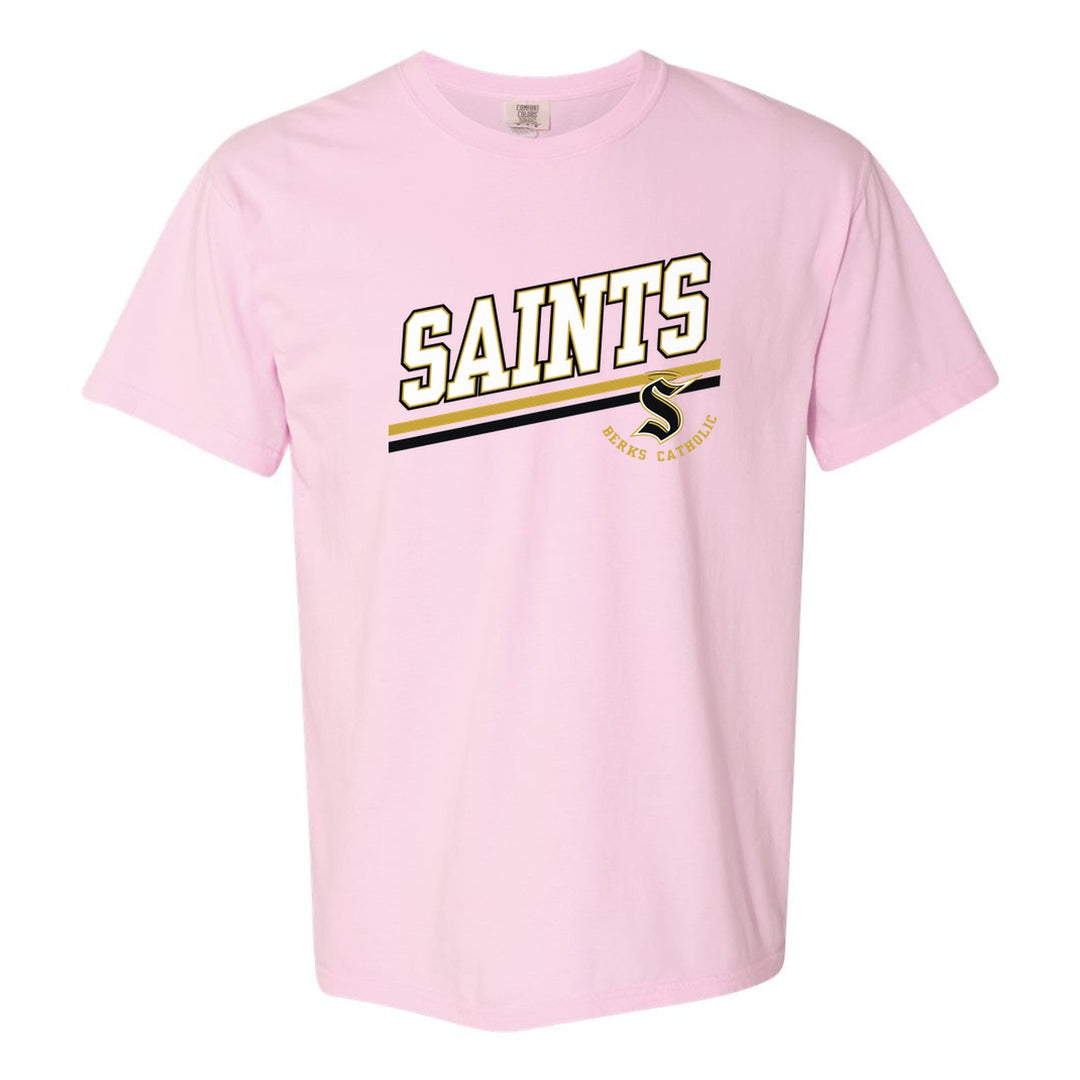 Berks Catholic Saints Slanted Stripe comfort colors t-shirt in Blossom: bold SAINTS lettering over a slanted double stripe, with the halo S and Berks Catholic