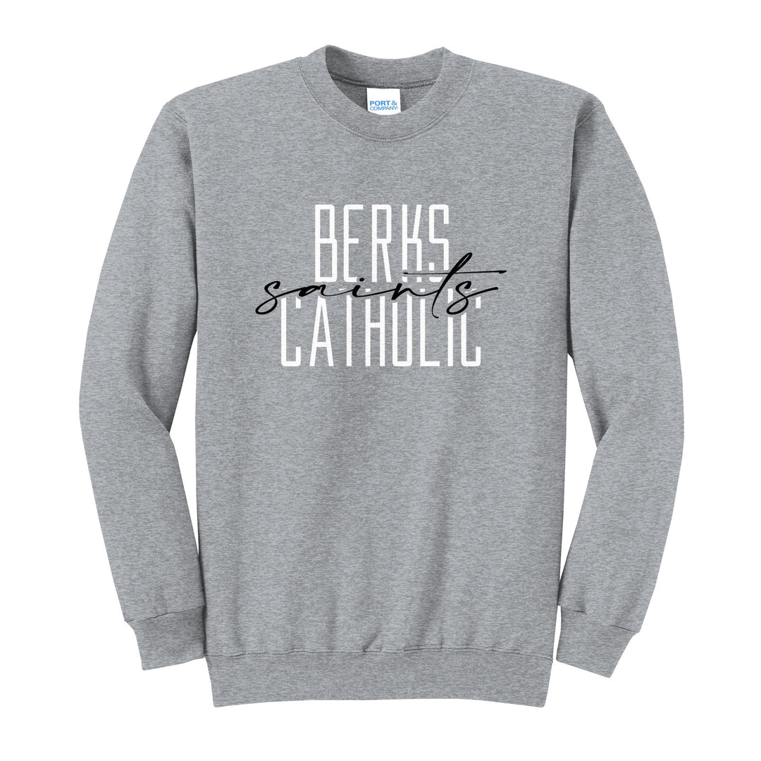 Berks Catholic Saints Tall Type Script crewneck sweatshirt in Athletic Heather: tall BERKS CATHOLIC lettering with saints in flowing script across the middle