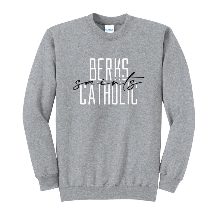 Berks Catholic Saints Tall Type Script crewneck sweatshirt in Athletic Heather: tall BERKS CATHOLIC lettering with saints in flowing script across the middle