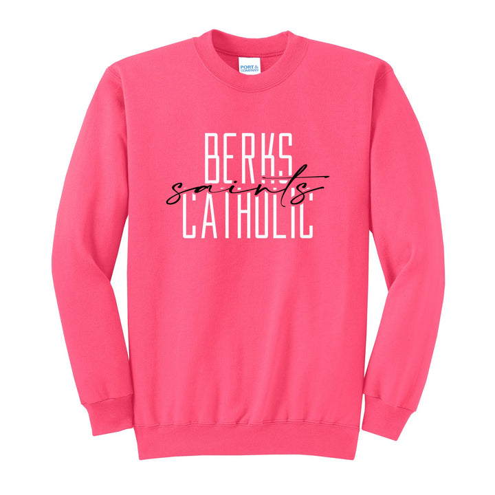 Berks Catholic Saints Tall Type Script crewneck sweatshirt in Neon Pink: tall BERKS CATHOLIC lettering with saints in flowing script across the middle