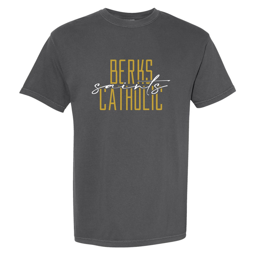 Berks Catholic Saints Tall Type Script comfort colors t-shirt in Pepper: tall BERKS CATHOLIC lettering with saints in flowing script across the middle