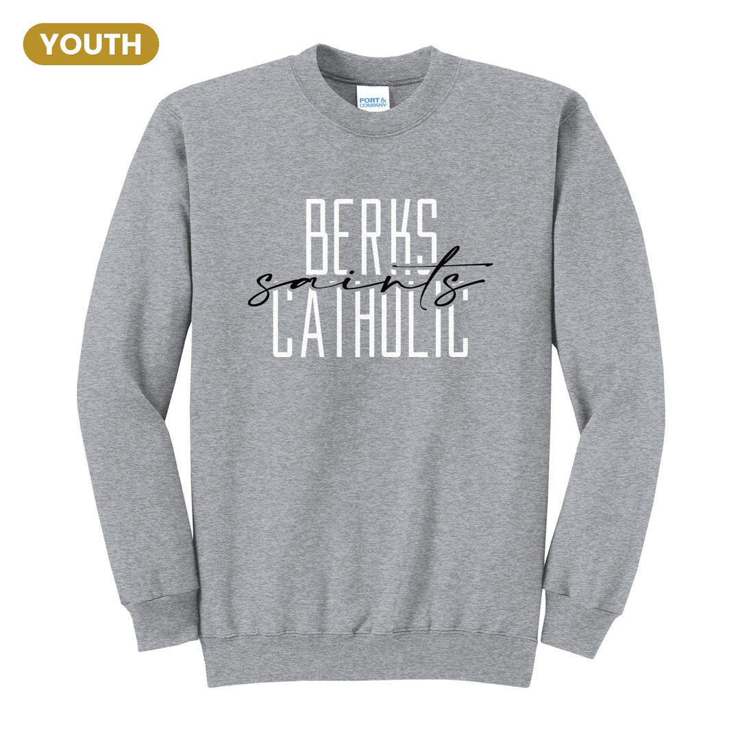 Berks Catholic Saints Tall Type Script youth crewneck sweatshirt in Athletic Heather: tall BERKS CATHOLIC lettering with saints in flowing script across the middle