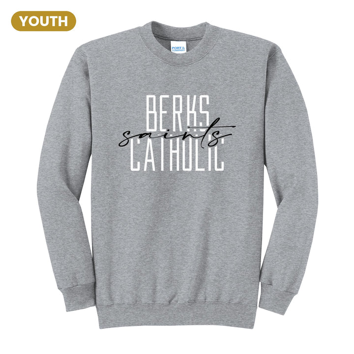Berks Catholic Saints Tall Type Script youth crewneck sweatshirt in Athletic Heather: tall BERKS CATHOLIC lettering with saints in flowing script across the middle