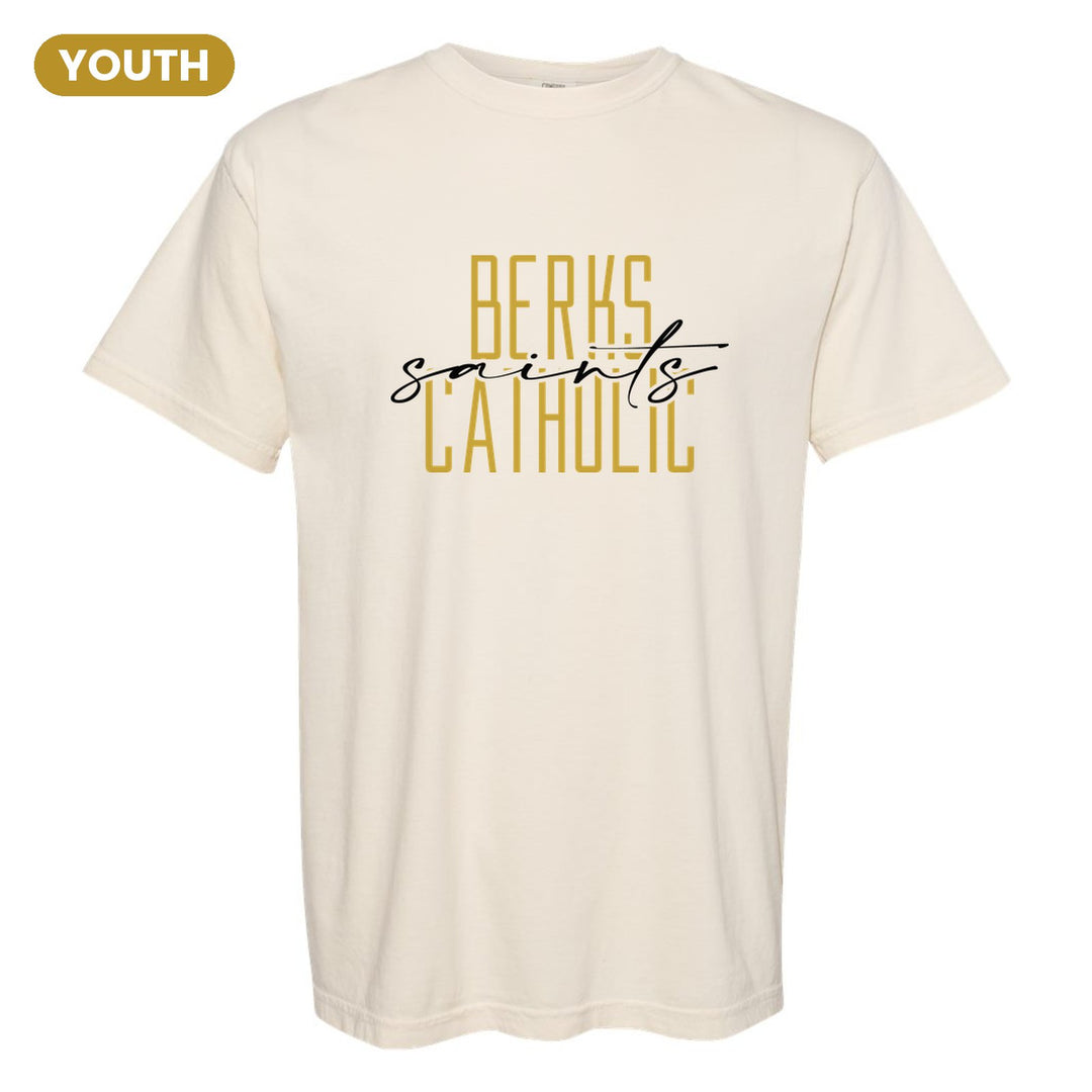 Berks Catholic Saints Tall Type Script youth comfort colors t-shirt in Ivory: tall BERKS CATHOLIC lettering with saints in flowing script across the middle