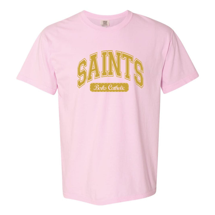 Berks Catholic Saints Varsity Arch comfort colors t-shirt in Blossom: arched varsity SAINTS lettering over a Berks Catholic badge