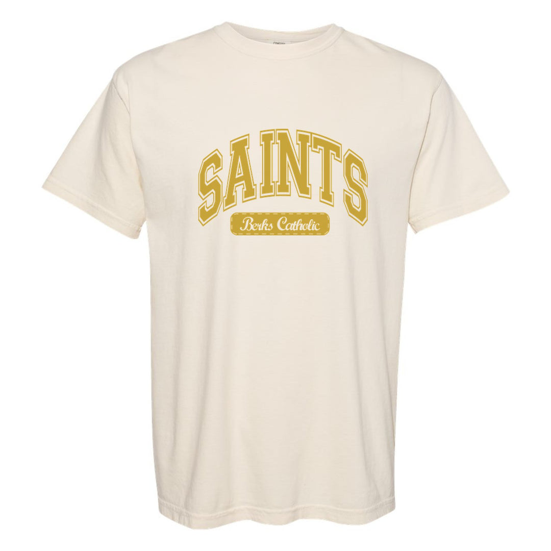 Berks Catholic Saints Varsity Arch comfort colors t-shirt in Ivory: arched varsity SAINTS lettering over a Berks Catholic badge