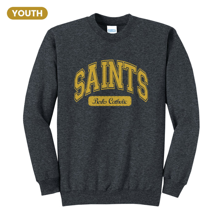 Berks Catholic Saints Varsity Arch youth crewneck sweatshirt in Dark Heather Grey: arched varsity SAINTS lettering over a Berks Catholic badge