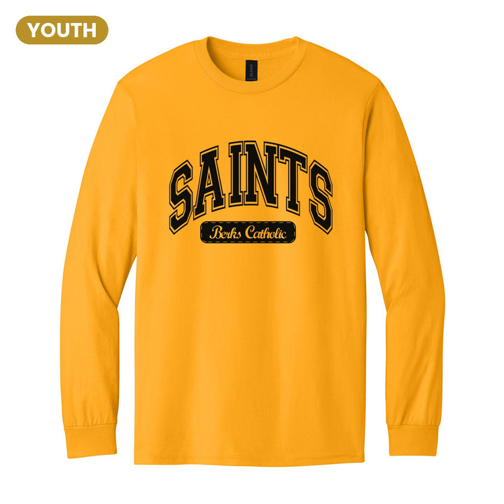Berks Catholic Saints Varsity Arch youth long sleeve t-shirt in Gold: arched varsity SAINTS lettering over a Berks Catholic badge