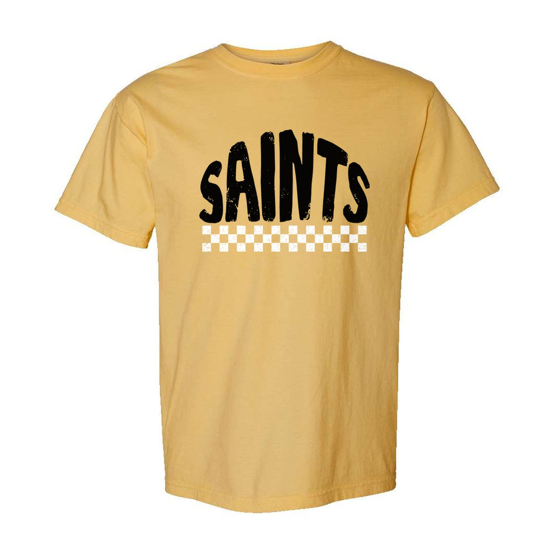 Berks Catholic Saints Checkered comfort colors t-shirt in Mustard: distressed SAINTS lettering over a checkerboard band