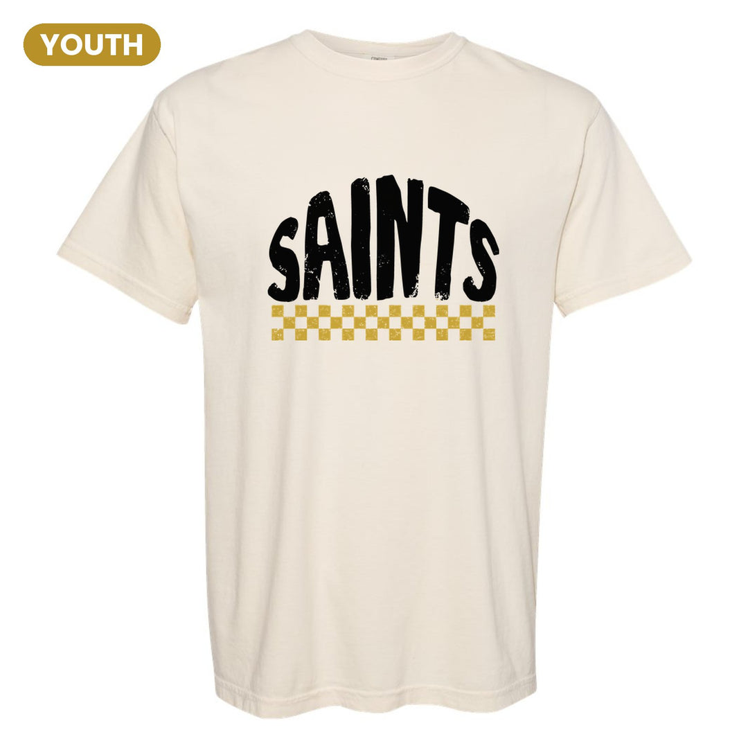 Berks Catholic Saints Checkered youth comfort colors t-shirt in Ivory: distressed SAINTS lettering over a checkerboard band