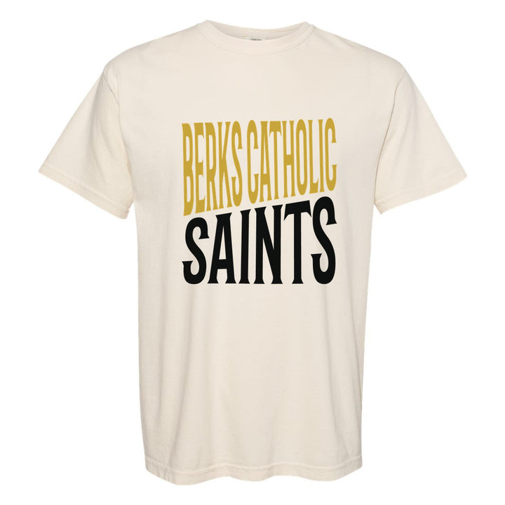 Berks Catholic Saints Block Stack comfort colors t-shirt in Ivory: tall BERKS CATHOLIC stacked over SAINTS in condensed block letters