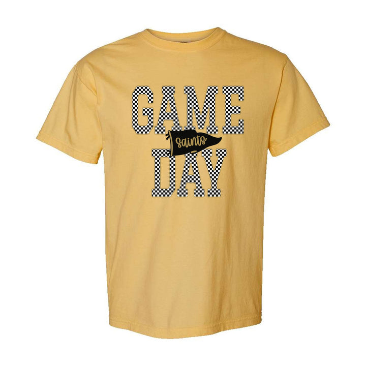 Berks Catholic Saints Game Day comfort colors t-shirt in Mustard: checkered GAME DAY lettering with a Saints pennant across the middle