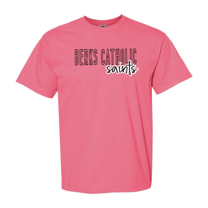 Berks Catholic Saints Outline Script comfort colors t-shirt in Crunchberry: outlined BERKS CATHOLIC letters with saints script across the front