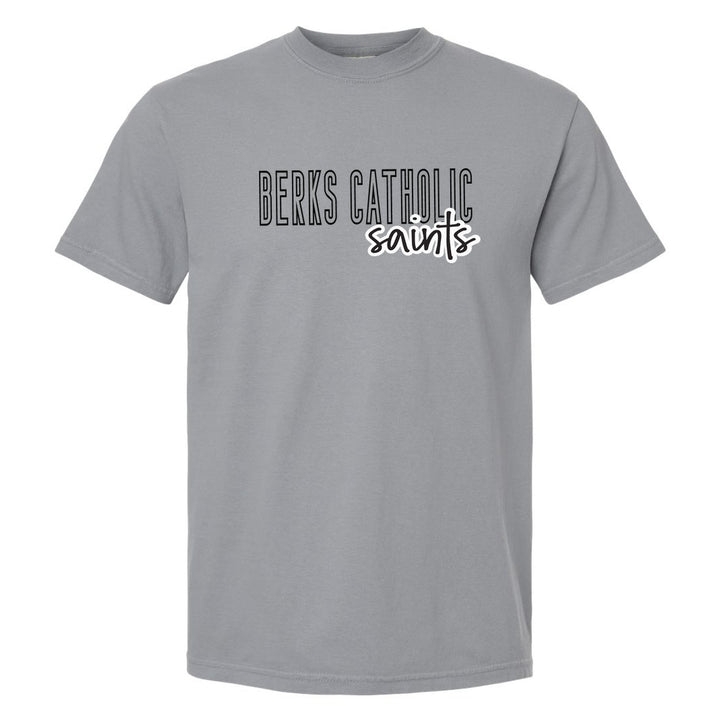 Berks Catholic Saints Outline Script comfort colors t-shirt in Granite: outlined BERKS CATHOLIC letters with saints script across the front