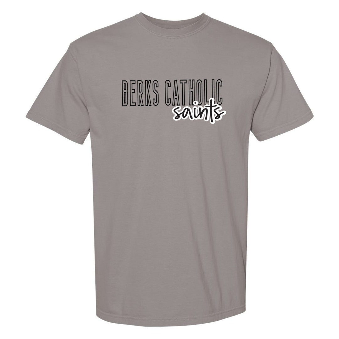 Berks Catholic Saints Outline Script comfort colors t-shirt in Grey: outlined BERKS CATHOLIC letters with saints script across the front