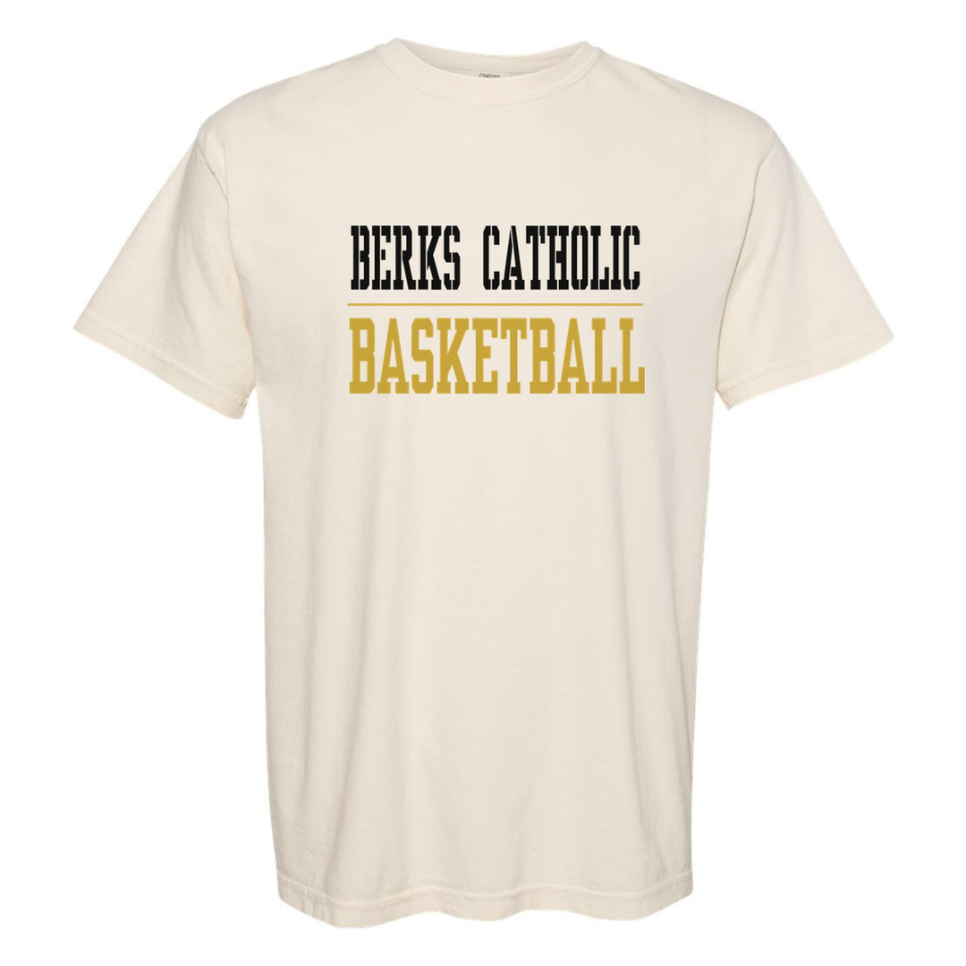 Berks Catholic Saints Sport or Activity comfort colors t-shirt in Ivory: BERKS CATHOLIC over a thin rule and BASKETBALL (your sport or activity) in block letters